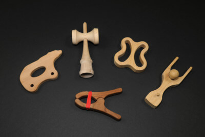 Assorted CNC routed and shaped wooden toy parts made from domestic hardwood species.