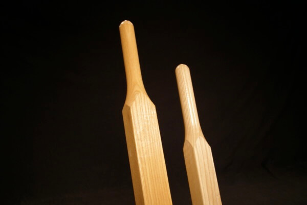 Pair of custom wood wheelbarrow handles made from durable hardwoods like ash and hickory.