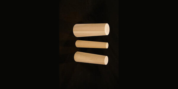 Custom Wood Spill Containment Plugs for Industrial and Emergency Use Three tapered wooden spill containment plugs designed for industrial leak control and emergency sealing.