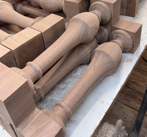 Exterior Sapele Balusters – Close-Up of New Turned Parts Close-up of newly turned Sapele balusters for exterior railing applications.
