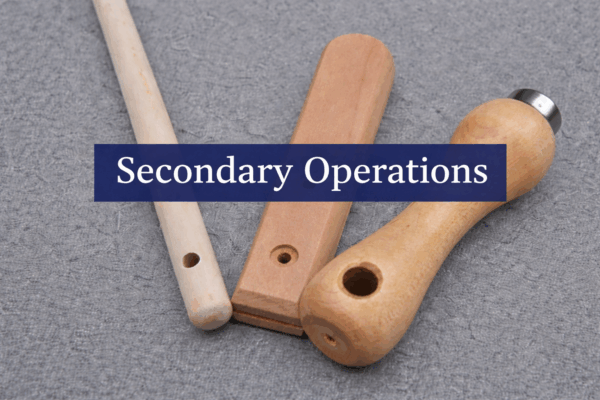 Wood components with drilled holes and machined features with a blue secondary operations label.