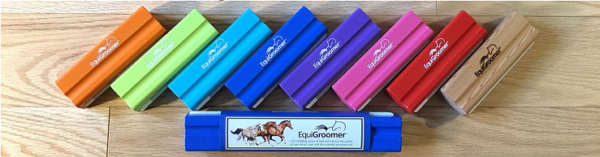 Row of EquiGroomer grooming tool handles in eight colors next to product packaging.