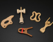 Assorted CNC routed and shaped wooden toy parts made from domestic hardwood species.