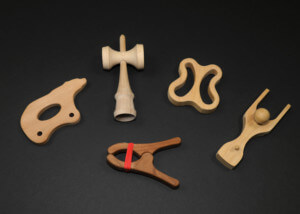 Assorted CNC routed and shaped wooden toy parts made from domestic hardwood species.