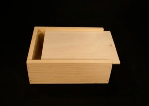 Custom wooden slide top box made from pine and Baltic birch for gift or product packaging.