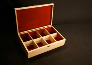 Custom wooden tea box with dividers and precision-crafted compartments.