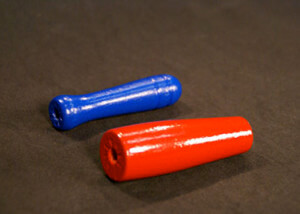 Two painted wooden jump rope handles with drilled ends and child-safe enamel finish.