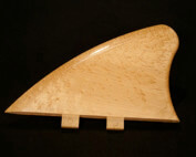 One custom-shaped wooden component designed for surfboard or specialty product applications.