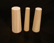Three custom tapered wooden plugs in different sizes for industrial sealing and manufacturing use.