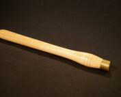 One custom-turned wooden handle with a brass ferrule for strength and durability.