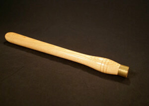 One custom-turned wooden handle with a brass ferrule for strength and durability.