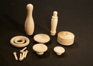 Assorted unfinished wood turnings made for high-volume production and specialty woodworking applications.