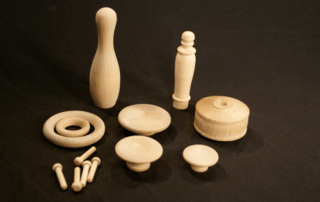 Assorted unfinished wood turnings made for high-volume production and specialty woodworking applications.