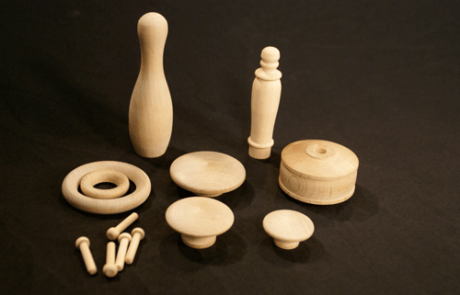Assorted unfinished wood turnings made for high-volume production and specialty woodworking applications.