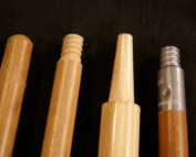 Four wooden broom and mop handles with varied end types including tenoned, tapered, and threaded attachments.
