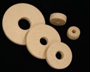 Five round wooden core plugs in various sizes made from particle board.