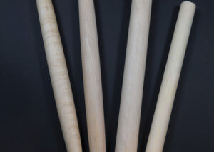 Four tapered French-style wooden rolling pins made from maple and other hardwoods.