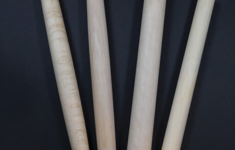 Four tapered French-style wooden rolling pins made from maple and other hardwoods.