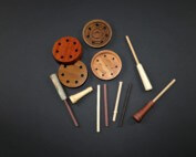 Assorted custom wooden game call barrels crafted from premium hardwoods with various finishes.