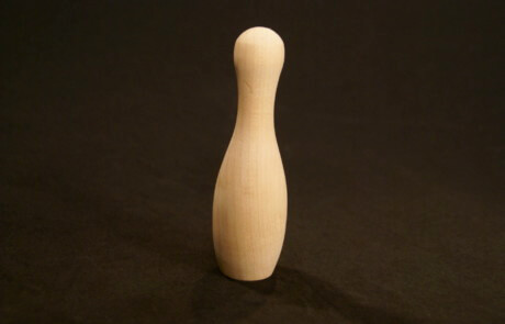Mini wooden bowling pin made to custom specifications for bulk manufacturing and children's games.