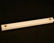 Custom wood moulding with drilled hole and secondary shaping for bulk manufacturing use.
