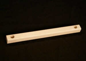 Custom wood moulding with drilled hole and secondary shaping for bulk manufacturing use.