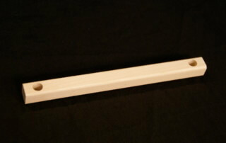 Custom wood moulding with drilled hole and secondary shaping for bulk manufacturing use.