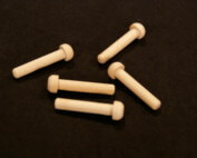 Five custom wooden pegs used in toy vehicles, furniture, and specialty wood products.