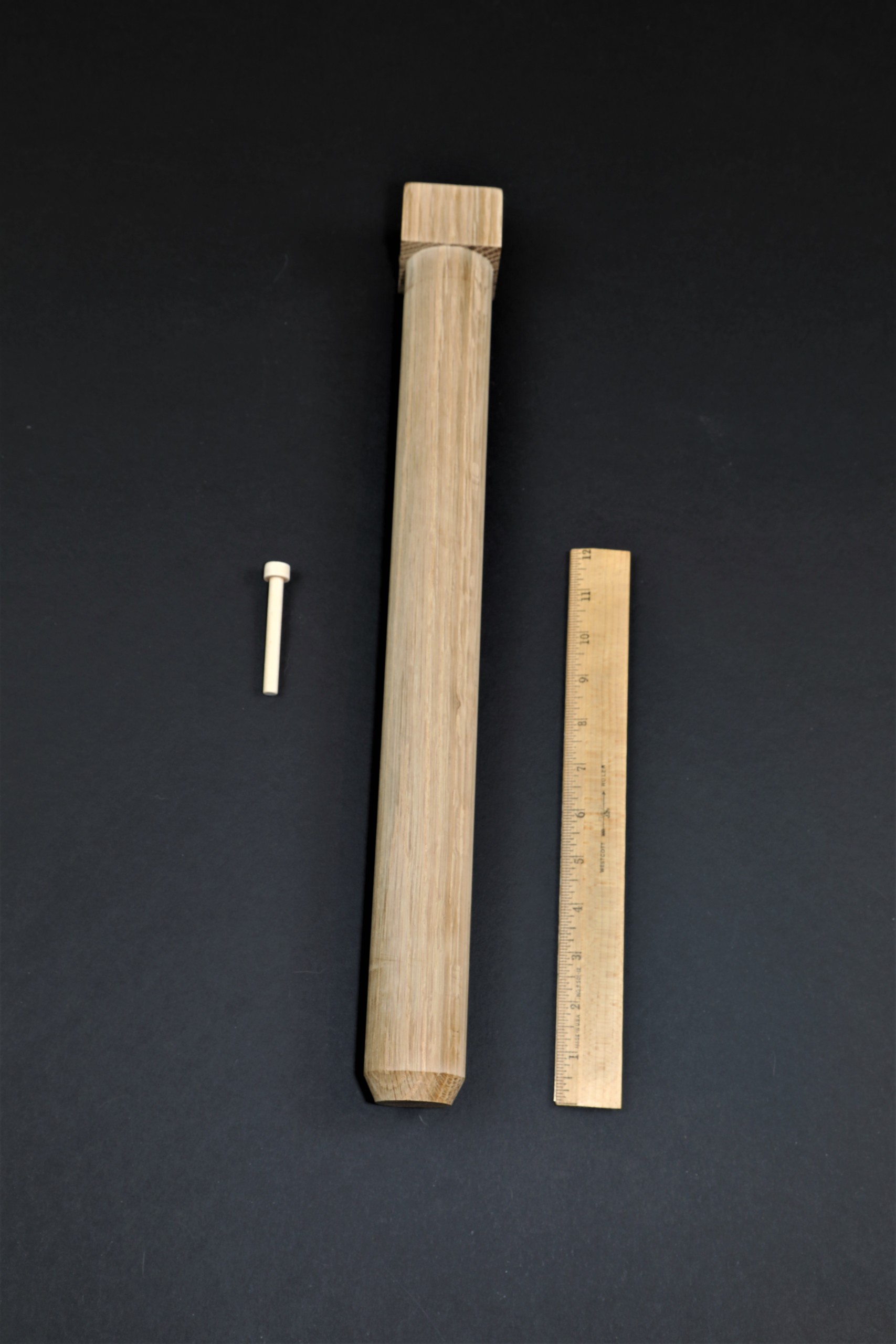 three Wooden Pegs in different sizes