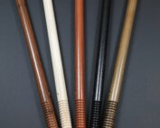 Five wooden police batons with beaded grips in a row, made from finished hardwood.