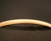 Steam bent wood chair part made from cherry with precision CNC routing, shown as a custom furniture component.