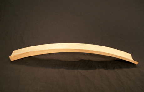 Steam bent wood chair part made from cherry with precision CNC routing, shown as a custom furniture component.