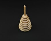 Single turned wooden toy part custom machined for bulk manufacturing applications.