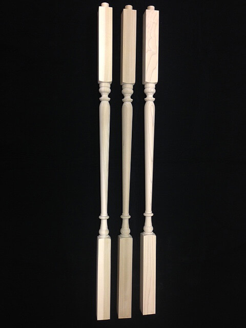 Three interior wood balusters