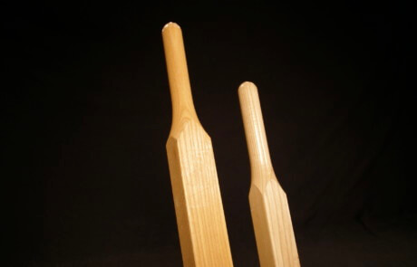 Pair of custom wood wheelbarrow handles made from durable hardwoods like ash and hickory.