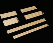 White birch wood skewers arranged in a bundle, produced in various lengths and diameters.