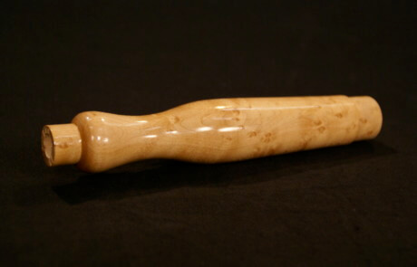 Premium custom wood handle with smooth finish and contoured shape for specialty and bulk manufacturing.