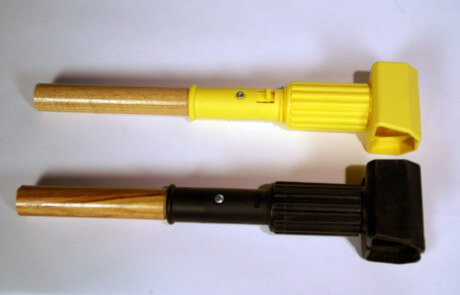 Two custom wooden handles with plastic end caps for utility tools and mops.