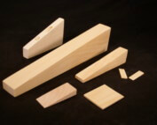 Custom wooden wedges in various sizes for industrial use and specialty manufacturing applications.