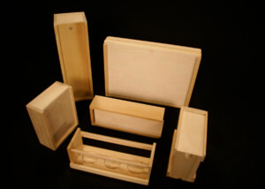 Custom wood beverage carrier and sliding lid boxes made for bulk packaging and display.