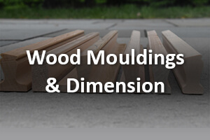 Assorted wooden mouldings and dimension stock in various profiles and sizes for custom manufacturing.