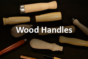 Multiple custom-turned wood handles in various shapes with holes and secondary operations.