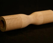 Grooved wooden parts custom made for musical instruments including tone blocks, mallet heads, and percussion components.