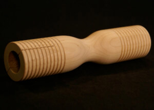 Grooved wooden parts custom made for musical instruments including tone blocks, mallet heads, and percussion components.
