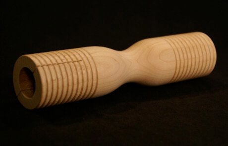 Grooved wooden parts custom made for musical instruments including tone blocks, mallet heads, and percussion components.