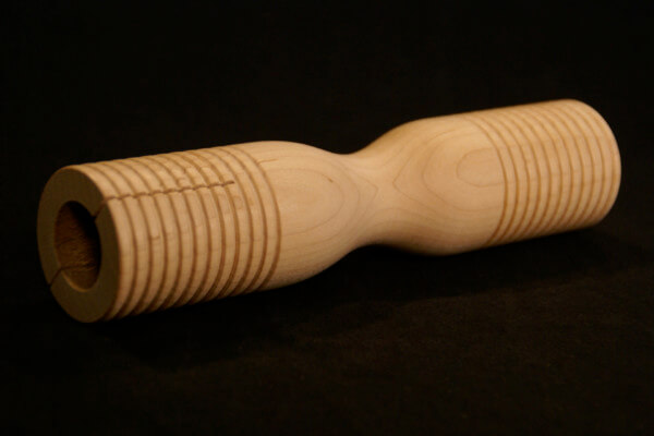Grooved wooden parts custom made for musical instruments including tone blocks, mallet heads, and percussion components.