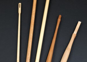 Assorted custom wood handles crafted from various domestic hardwood species.
