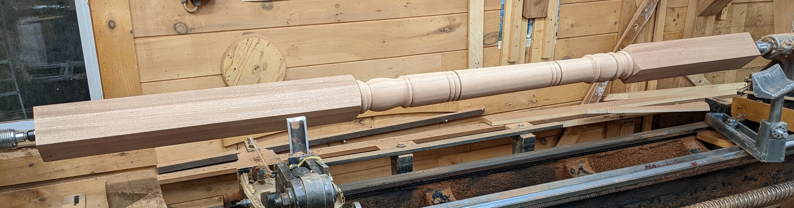 Mahogany Post being turned on a lathe