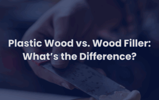 Person applying wood filler with a putty knife, representing the difference between plastic wood and wood filler.